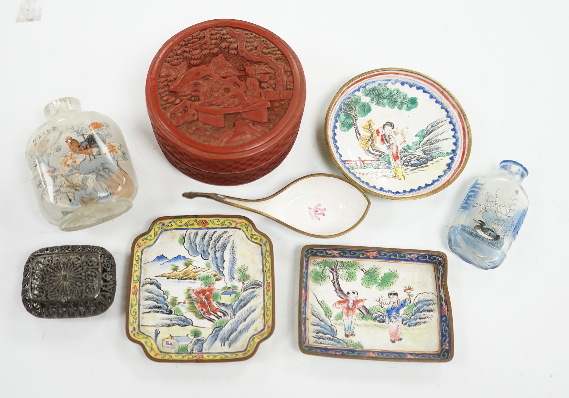 A group of Chinese Canton enamel trays, a Chinese lacquer box and cover, snuff bottles, two filigree work boxes, and a champlevé enamel box and cover, largest 10cm in diameter. Condition - varies